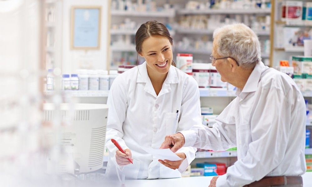 Pharmacist helping a customer at the counter